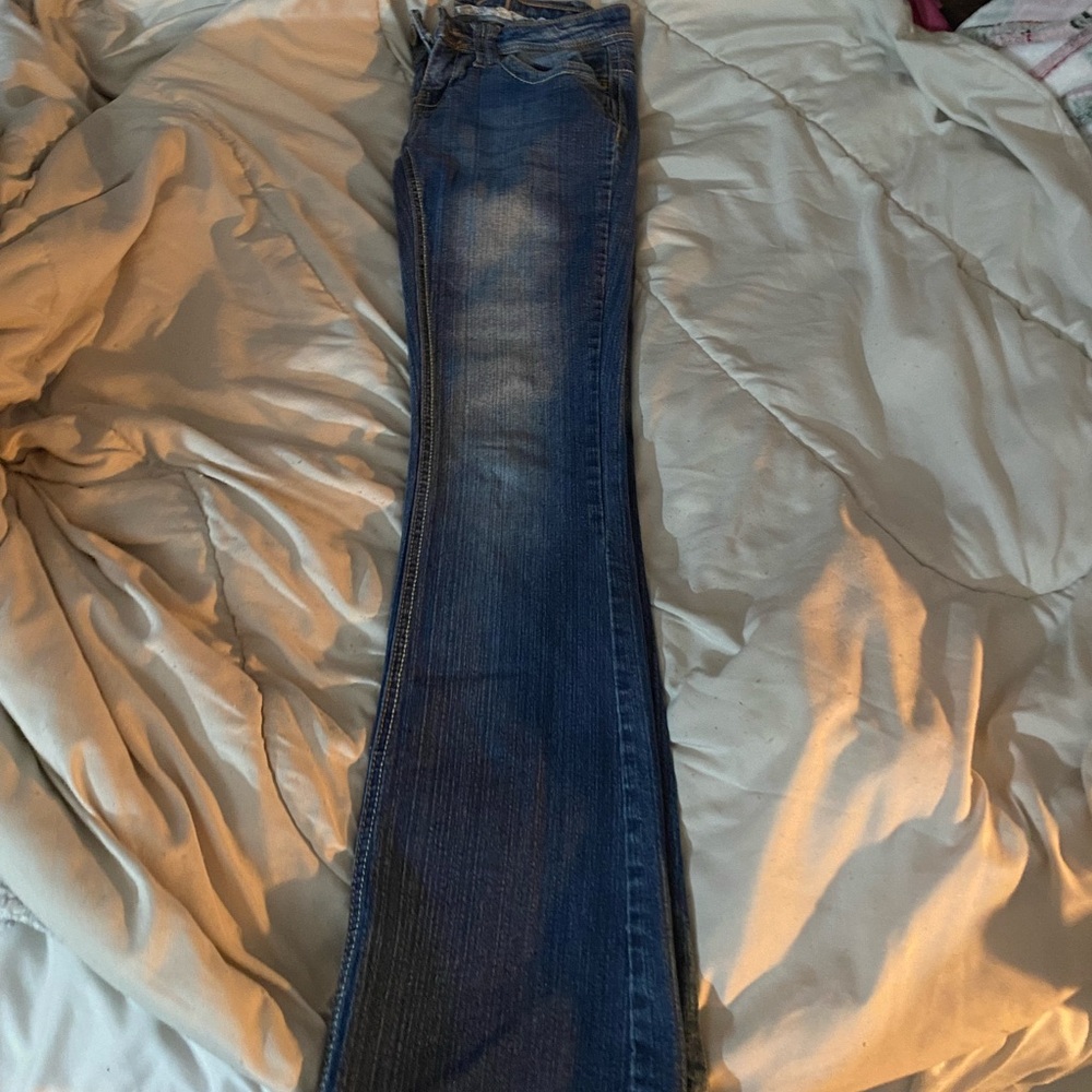 pair of rue 21 jeans low rise slim boot cut in a size 0S